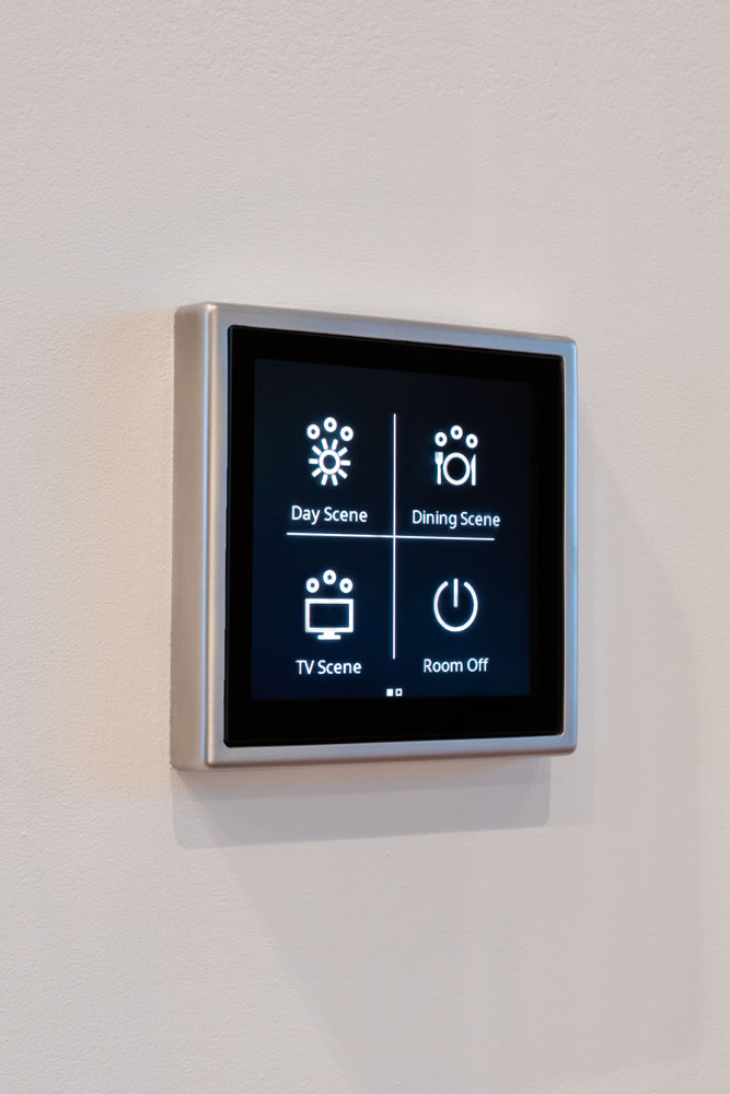 Detail of luxury smart home wall control panel and architectural lighting