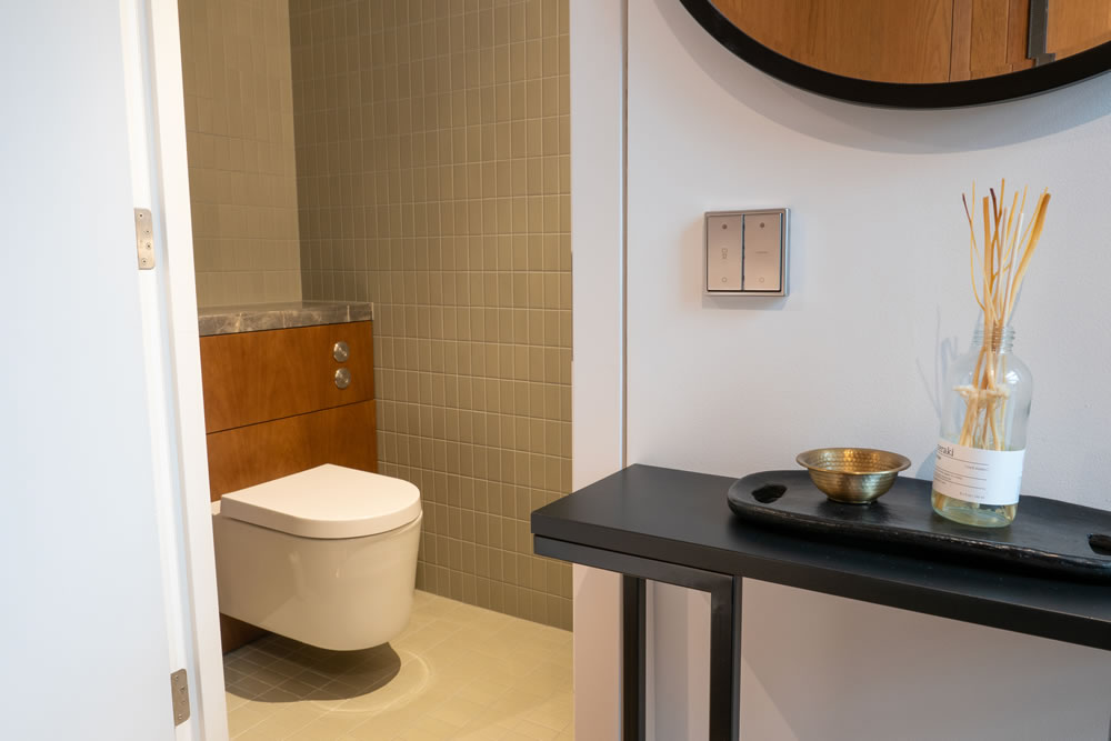 Smart bathroom automation with waterproof lighting and integrated temperature sensors